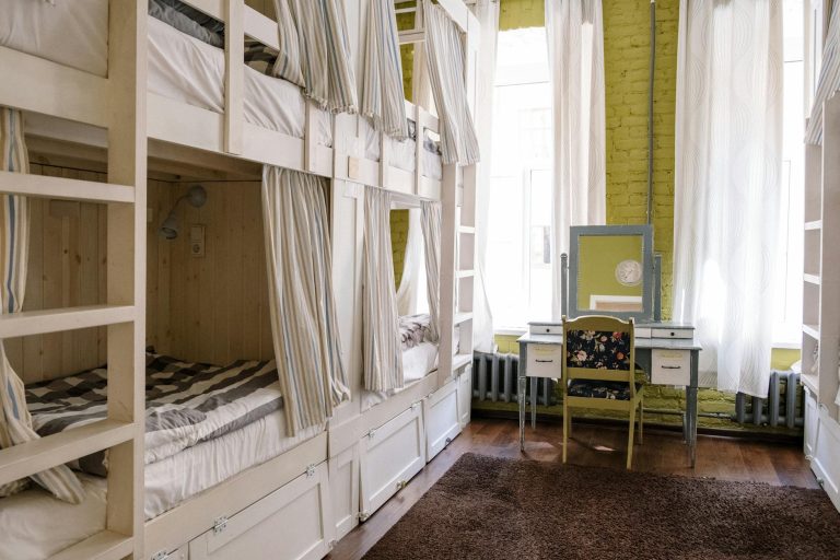 Comfortable hostel dorm room with clean bunk beds and a cozy ambiance.