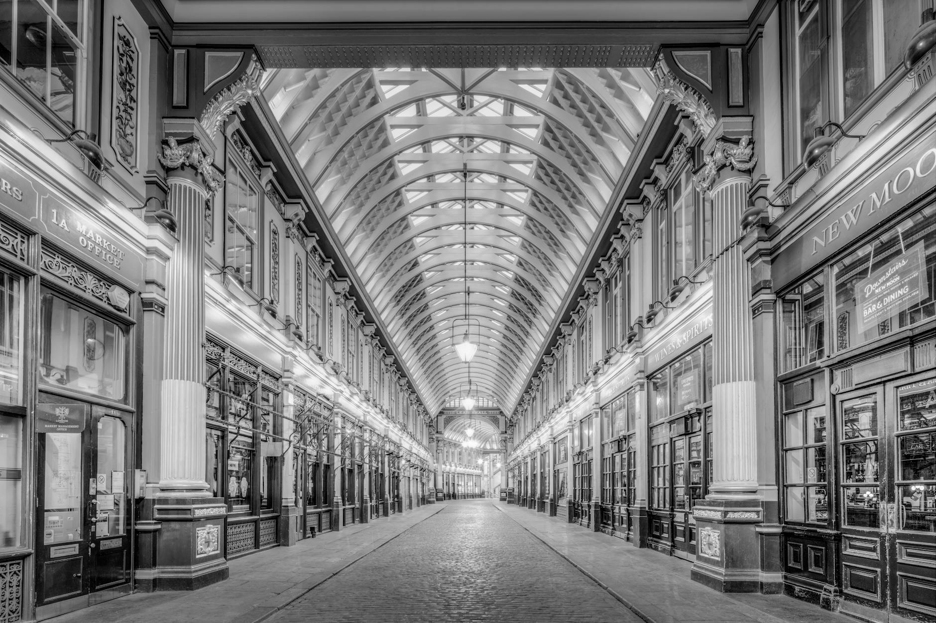 A classic monochrome view of the historic Leadenhall Market's stunning architecture in London, UK.