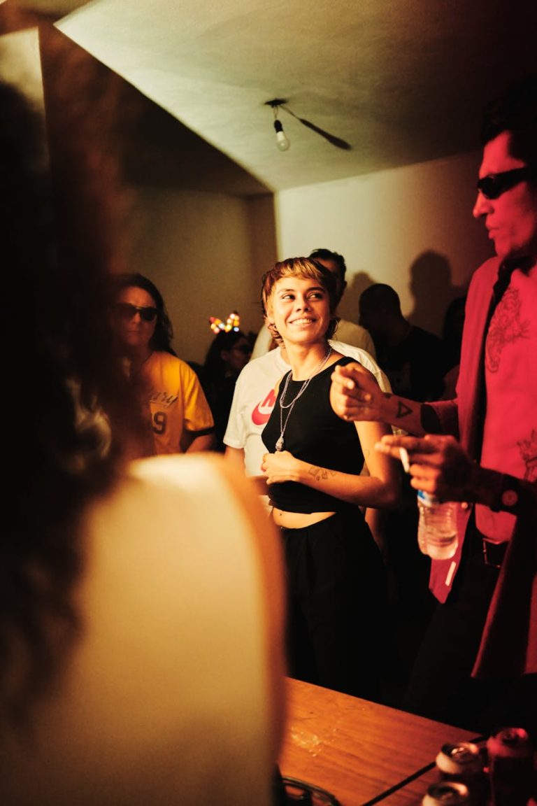 Vibrant party scene in a nightclub in Leon, Mexico with people enjoying music and dancing.