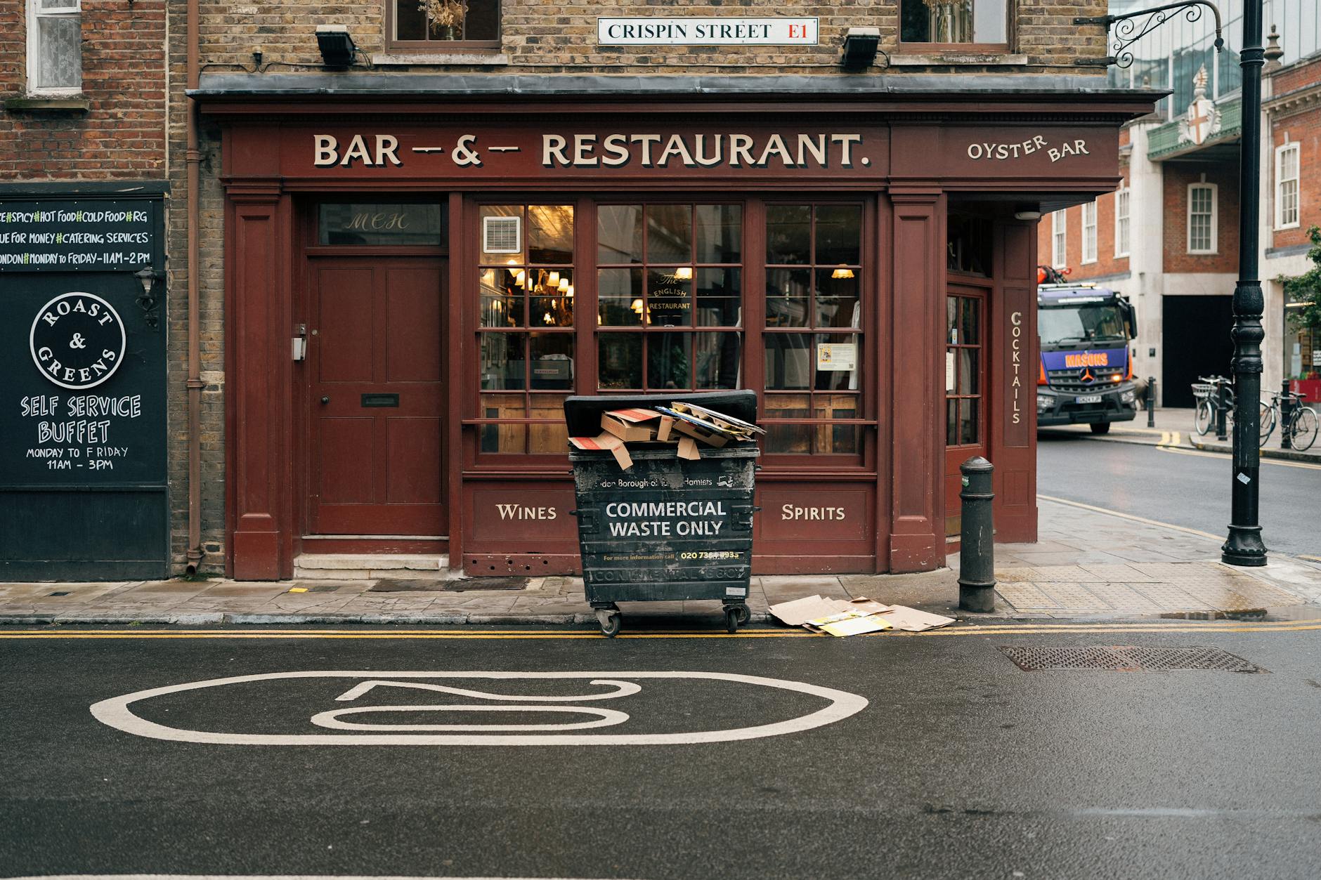Charming London street view featuring a classic bar and restaurant facade on Crispin Street.