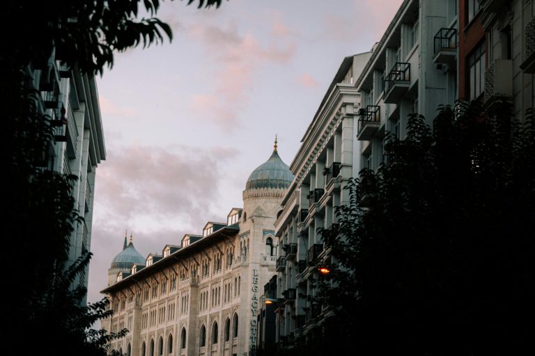 Stunning view of classic urban architecture with a dramatic sky background at sunset.