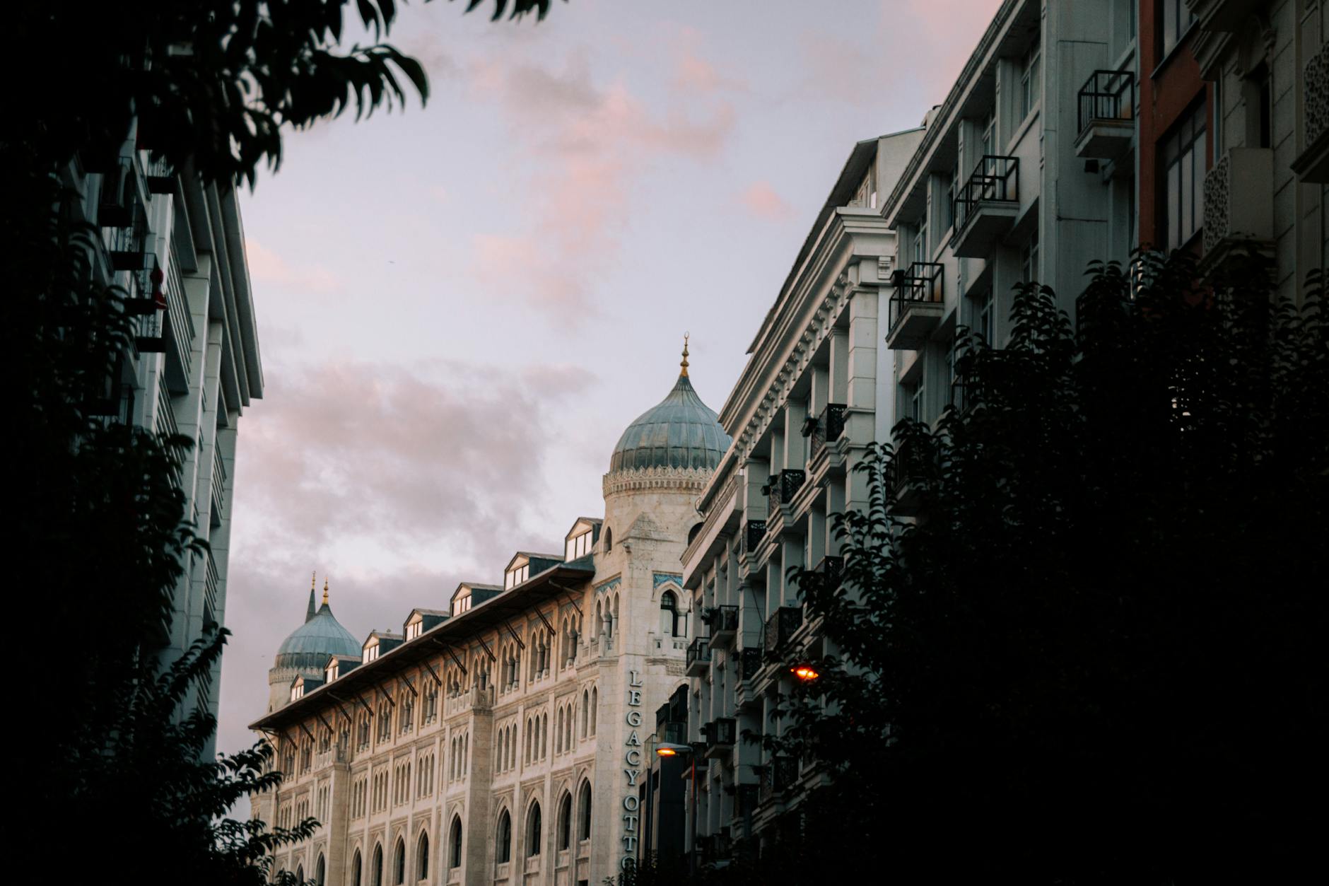 Stunning view of classic urban architecture with a dramatic sky background at sunset.