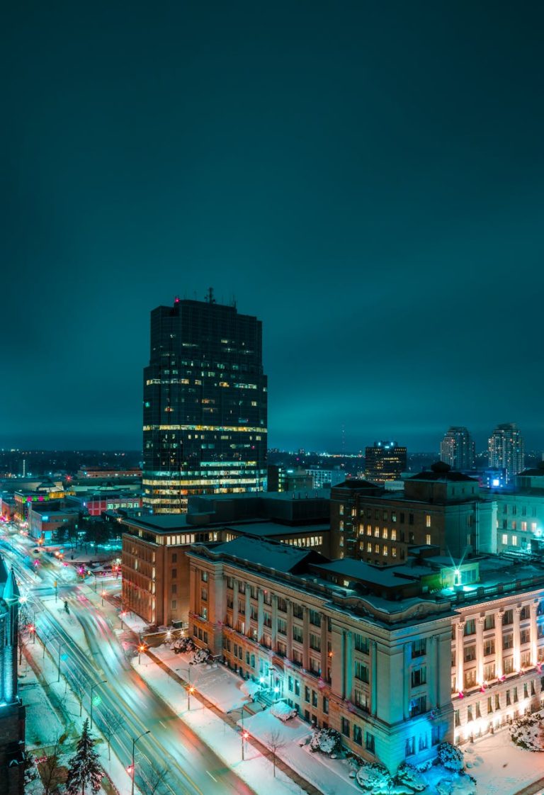Stunning long-exposure shot of London's illuminated skyline in winter, highlighting modern architecture.