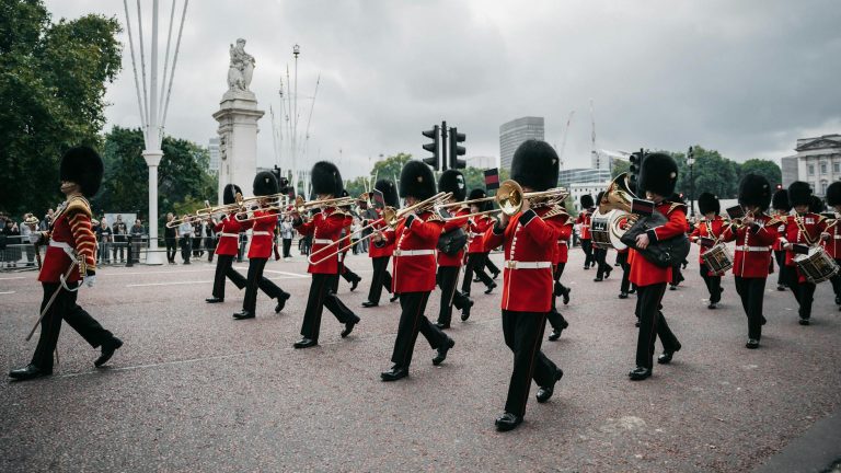 Ceremonial parade of soldiers in traditional uniform marching in London.