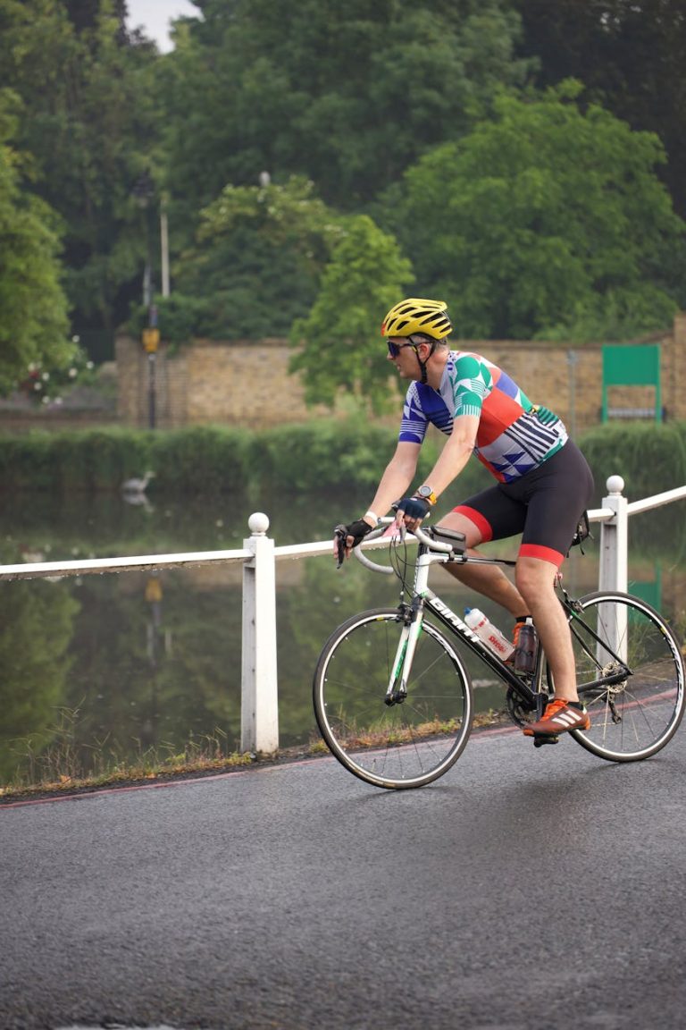 Adult cyclist riding along a scenic path, enjoying a leisurely outdoor bike ride.